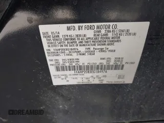 2014 Ford Taurus SEL with VIN 1FAHP2E83EG184976, listed as a IAAI auction lot 41590153 with 177,342 mi miles. Bid and sale history available at carsss.com. Image 9.