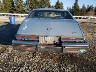 1984 Cadillac Seville z VIN 1G6AS6987EE810927, wystawiony jako Copart lot #42836105 z przebiegiem 19 894 mil mil oraz Tytuł czysty. Historia ofert i sprzedaży dostępna na DreamBid. Obrazek 6.