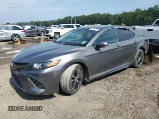 2018 Toyota Camry LE z VIN 4T1B11HKXJU094606, wystawiony jako Copart lot #63212705 z przebiegiem 144 888 mil mil oraz Szkoda całkowita • Salvage title. Historia ofert i sprzedaży dostępna na DreamBid. Obrazek 1.