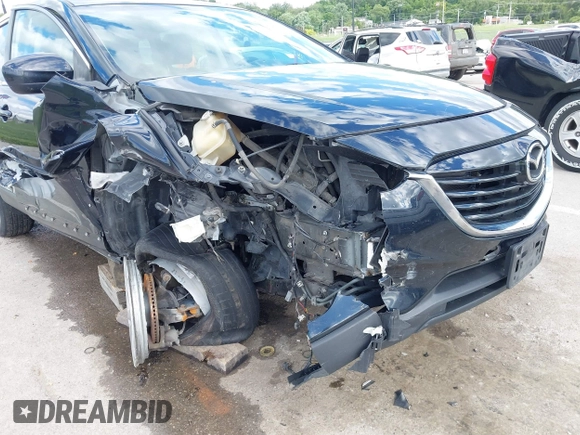 2014 Mazda CX-9 Touring with VIN JM3TB2CA9E0442202, listed as a IAAI auction lot 42292356 with 239,578 mi miles and . Bid and sale history available at DreamBid. Image 6.