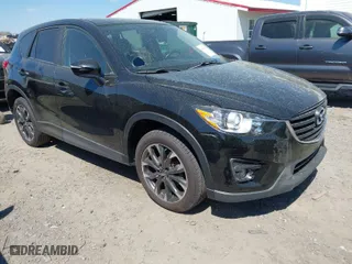 2016 Mazda CX-5 Grand Touring with VIN JM3KE4DY9G0893174, listed as a IAAI auction lot 41887814 with 79,811 mi miles. Bid and sale history available at carsss.com. Image 1.