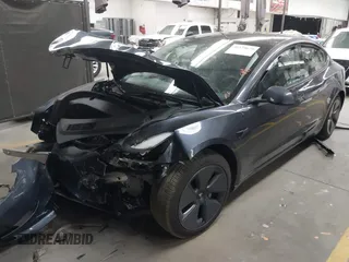 2023 Tesla Model 3 with VIN 5YJ3E1EAXPF669538, listed as a IAAI auction lot 40329679 with 16,612 mi miles and . Bid and sale history available at DreamBid. Image 2.