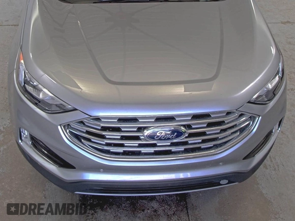 2020 Ford Edge Titanium z VIN 2FMPK4K91LBA91290, wystawiony jako IAAI lot #42494043 z przebiegiem 71 254 mil mil oraz . Historia ofert i sprzedaży dostępna na DreamBid. Obrazek 26.