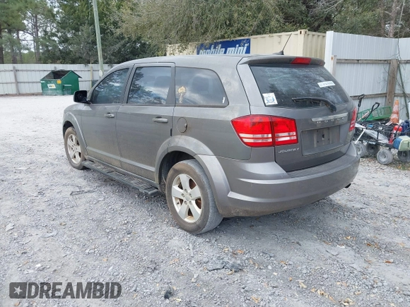 2013 Dodge Journey SE z VIN 3C4PDCAB2DT577805, wystawiony jako IAAI lot #41674351 z przebiegiem 183 006 mil mil oraz . Historia ofert i sprzedaży dostępna na DreamBid. Obrazek 3.
