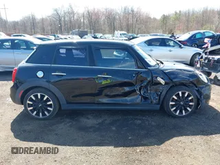 2017 MINI Hardtop 4 Door Cooper S z VIN WMWXU3C39H2F48699, wystawiony jako IAAI lot #41924423 z przebiegiem 81 249 mil mil oraz . Historia ofert i sprzedaży dostępna na DreamBid. Obrazek 13.