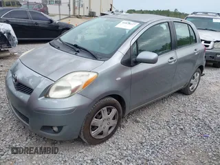 2010 Toyota Yaris with VIN JTDKT4K38A5296999, listed as a IAAI auction lot 41878127 with 122,692 mi miles. Bid and sale history available at carsss.com. Image 2.