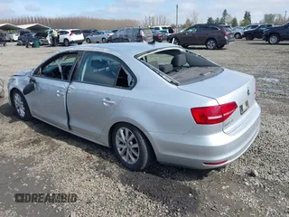 2015 Volkswagen Jetta Sedan 1.8T SE with VIN 3VWD17AJ3FM297573, listed as a IAAI auction lot 41884541 with 98,225 mi miles. Bid and sale history available at carsss.com. Image 3.