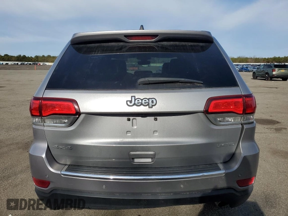 2021 Jeep Grand Cherokee 80th Anniversary with VIN 1C4RJFBG7MC665757, listed as a Copart auction lot 52443235 with 99,828 mi miles and Salvage Title. Bid and sale history available at DreamBid. Image 6.