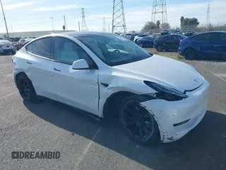 2021 Tesla Model Y Standard Range z VIN 5YJYGDED4MF123311, wystawiony jako IAAI lot #41200519 z przebiegiem 70 190 mil mil oraz . Historia ofert i sprzedaży dostępna na DreamBid. Obrazek 1.