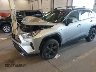 2021 Toyota RAV4 Hybrid XSE with VIN JTME6RFV9MJ006665, listed as a IAAI auction lot 41964182 with 61,654 mi miles and . Bid and sale history available at DreamBid. Image 6.
