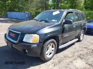 2005 GMC Envoy SLE z VIN 1GKDT13S452198027, wystawiony jako IAAI lot #42243258 z przebiegiem 144 240 mil mil oraz . Historia ofert i sprzedaży dostępna na DreamBid. Obrazek 2.