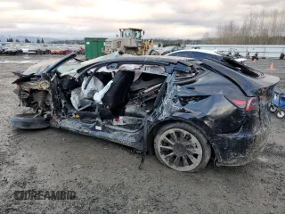 2023 Tesla Model Y Long Range with VIN 7SAYGAEE0PF832185, listed as a Copart auction lot 85159764 with Not Provided miles and Salvage Title. Bid and sale history available at DreamBid. Image 2.
