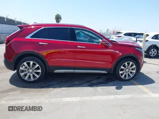 2021 Cadillac XT4 FWD Premium Luxury z VIN 1GYFZCR48MF004849, wystawiony jako IAAI lot #42131896 z przebiegiem 9 864 mil mil oraz . Historia ofert i sprzedaży dostępna na DreamBid. Obrazek 13.