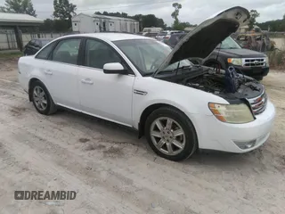 2008 Ford Taurus SEL z VIN 1FAHP24W48G108431, wystawiony jako IAAI lot #42353102 z przebiegiem 121 982 mil mil oraz . Historia ofert i sprzedaży dostępna na DreamBid. Obrazek 1.