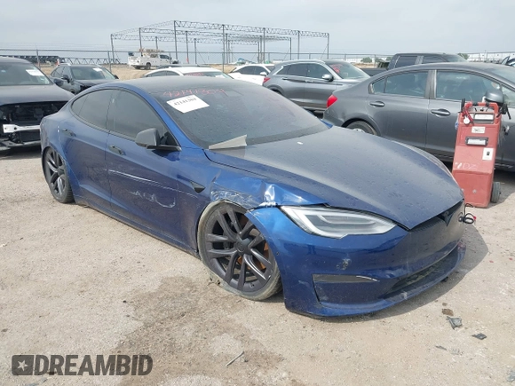 2021 Tesla Model S Plaid with VIN 5YJSA1E64MF442036, listed as a IAAI auction lot 42141304 with 24,998 mi miles and . Bid and sale history available at DreamBid. Image 1.