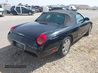 2002 Ford Thunderbird w/Hardtop Premium with VIN 1FAHP60A72Y129115, listed as a IAAI auction lot 41768100 with 54,393 mi miles. Bid and sale history available at carsss.com. Image 4.