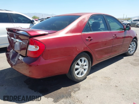 2002 Toyota Camry LE z VIN 4T1BE32K52U082454, wystawiony jako IAAI lot #42276881 z przebiegiem 225 814 mil mil oraz . Historia ofert i sprzedaży dostępna na DreamBid. Obrazek 4.