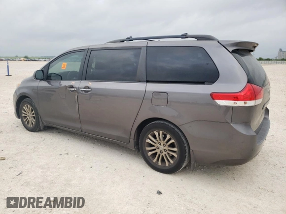 2014 Toyota Sienna XLE with VIN 5TDYK3DC2ES510647, listed as a Copart auction lot 54488845 with 216,091 mi miles and Salvage Title. Bid and sale history available at DreamBid. Image 2.