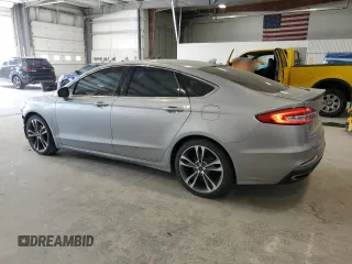 2020 Ford Fusion Titanium с VIN 3FA6P0K90LR112034, выставлен на аукционе Copart как лот 56740025 с пробегом 89 117 миль миль и Списание • Salvage title. История ставок и продаж доступна на DreamBid. Изображение 2.