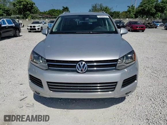 2014 Volkswagen Touareg Sport with VIN WVGEF9BP8ED005445, listed as a Copart auction lot 53694215 with 194,711 mi miles and Salvage Title. Bid and sale history available at DreamBid. Image 14.
