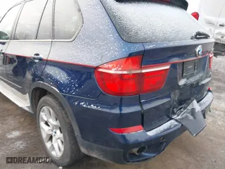 2011 BMW X5 35i with VIN 5UXZV4C54BL738262, listed as a IAAI auction lot 41633474 with 173,914 mi miles. Bid and sale history available at carsss.com. Image 20.