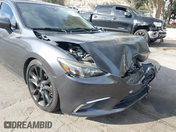 2016 Mazda Mazda6 i Grand Touring with VIN JM1GJ1W57G1441102, listed as a IAAI auction lot 41687057 with 144,876 mi miles. Bid and sale history available at carsss.com. Image 11.