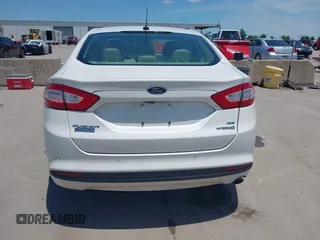 2014 Ford Fusion SE Hybrid with VIN 3FA6P0LUXER233658, listed as a IAAI auction lot 42311588 with 106,282 mi miles and . Bid and sale history available at DreamBid. Image 16.