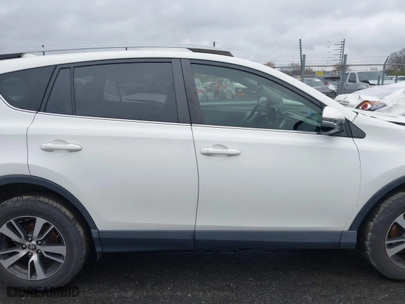 2017 Toyota RAV4 XLE with VIN JTMRFREV6HJ716907, listed as a IAAI auction lot 41056444 with 118,335 mi miles. Bid and sale history available at carsss.com. Image 13.