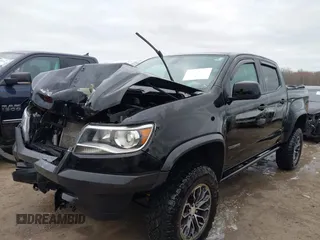 2018 Chevrolet Colorado 4WD ZR2 with VIN 1GCGTEEN9J1173647, listed as a IAAI auction lot 42016015 with 102,041 mi miles. Bid and sale history available at carsss.com. Image 2.