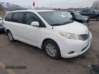 2014 Toyota Sienna XLE with VIN 5TDYK3DC9ES424879, listed as a IAAI auction lot 41492384 with 106,688 mi miles. Bid and sale history available at carsss.com. Image 1.