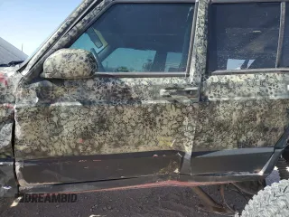 1999 Jeep Cherokee Sport with VIN 1J4FF68S6XL645028, listed as a Copart auction lot 48897255 with 218,552 mi miles and Salvage Title. Bid and sale history available at carsss.com. Image 7.