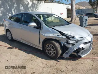 2020 Toyota Prius L Eco z VIN JTDKARFU8L3112245, wystawiony jako IAAI lot #42297733 z przebiegiem 136 450 mil mil oraz . Historia ofert i sprzedaży dostępna na DreamBid. Obrazek 1.