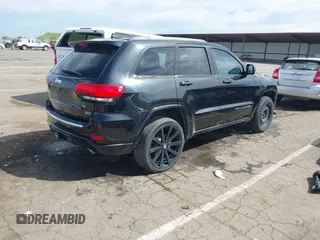 2014 Jeep Grand Cherokee Overland with VIN 1C4RJFCT8EC106005, listed as a IAAI auction lot 41989721 with 148,469 mi miles and . Bid and sale history available at DreamBid. Image 4.