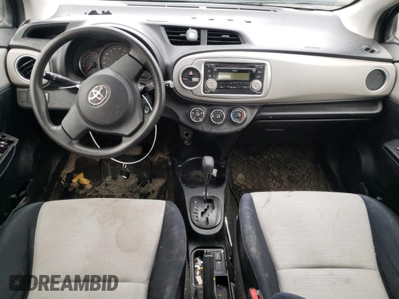 2012 Toyota Yaris L with VIN JTDKTUD33CD517298, listed as a Copart auction lot 52099335 with Not Provided miles and Salvage Title. Bid and sale history available at DreamBid. Image 8.