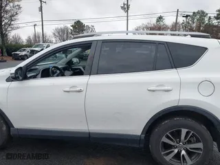 2017 Toyota RAV4 XLE with VIN JTMRFREV6HJ716907, listed as a IAAI auction lot 41056444 with 118,335 mi miles. Bid and sale history available at carsss.com. Image 14.
