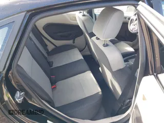 2013 Ford Fiesta S z VIN 3FADP4AJ2DM129703, wystawiony jako IAAI lot #41669041 z przebiegiem 138 831 mil mil oraz . Historia ofert i sprzedaży dostępna na DreamBid. Obrazek 8.