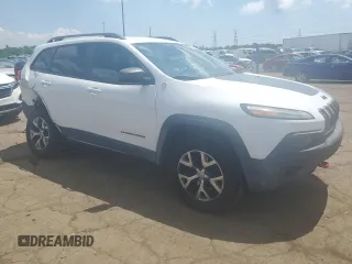 2015 Jeep Cherokee Trailhawk with VIN 1C4PJMBSXFW651000, listed as a Copart auction lot 64110515 with 135,571 mi miles and Clean title. Bid and sale history available at DreamBid. Image 4.