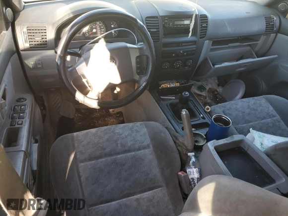 2006 Kia Sorento LX z VIN KNDJD733565554332, wystawiony jako Copart lot #87100544 z przebiegiem 212 084 mil mil oraz Nie do naprawy • Non repairable. Historia ofert i sprzedaży dostępna na DreamBid. Obrazek 8.