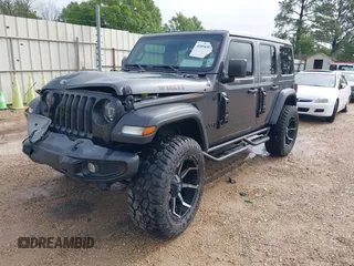 2021 Jeep Wrangler Unlimited Sport S with VIN 1C4HJXDG2MW700461, listed as a IAAI auction lot 41894307 with 82,454 mi miles. Bid and sale history available at carsss.com. Image 2.