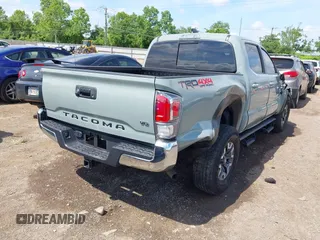 2023 Toyota Tacoma SR with VIN 3TMCZ5AN1PM581266, listed as a IAAI auction lot 42371395 with 32,582 mi miles and . Bid and sale history available at DreamBid. Image 4.