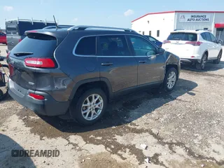 2016 Jeep Cherokee Latitude with VIN 1C4PJLCB1GW113585, listed as a IAAI auction lot 42457964 with 92,736 mi miles and . Bid and sale history available at DreamBid. Image 4.