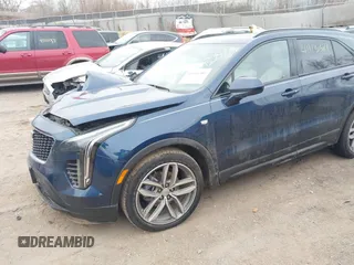 2020 Cadillac XT4 AWD Sport with VIN 1GYFZFR48LF101467, listed as a IAAI auction lot 41113381 with 72,841 mi miles and . Bid and sale history available at DreamBid. Image 2.