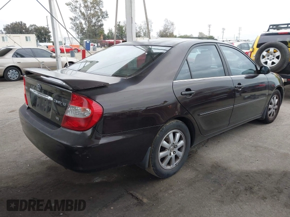 2002 Toyota Camry XLE z VIN JTDBF32K520006497, wystawiony jako IAAI lot #42021538 z przebiegiem 162 583 mil mil oraz . Historia ofert i sprzedaży dostępna na DreamBid. Obrazek 4.