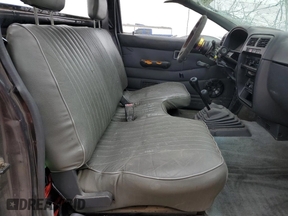 1995 Nissan Frontier XE with VIN 1N6SD11Y2SC308065, listed as a Copart auction lot 45282595 with 51,994 mi miles and Salvage title. Bid and sale history available at DreamBid. Image 7.