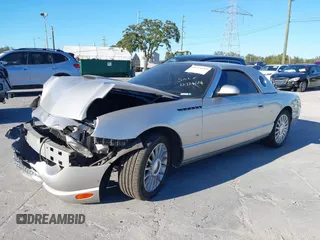 2004 Ford Thunderbird Deluxe with VIN 1FAHP60A84Y100984, listed as a IAAI auction lot 40978553 with 113,051 mi miles. Bid and sale history available at carsss.com. Image 2.