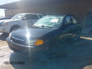 2000 Mazda Protege DX with VIN JM1BJ2227Y0303448, listed as a IAAI auction lot 41482747 with 206,542 mi miles and . Bid and sale history available at DreamBid. Image 2.
