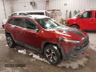 2015 Jeep Cherokee Trailhawk with VIN 1C4PJMBS2FW609999, listed as a IAAI auction lot 41582536 with 133,666 mi miles. Bid and sale history available at carsss.com. Image 1.