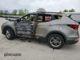 2017 Hyundai Santa Fe 2.4L z VIN 5NMZUDLB0HH042101, wystawiony jako Copart lot #55058145 z przebiegiem Nie podano mil oraz Szkoda całkowita • Salvage title. Historia ofert i sprzedaży dostępna na DreamBid. Obrazek 2.