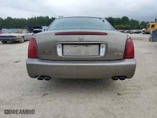 2000 Cadillac DeVille DTS with VIN 1G6KF5794YU249059, listed as a Copart auction lot 71614494 with 121,611 mi miles and Salvage Title. Bid and sale history available at carsss.com. Image 6.