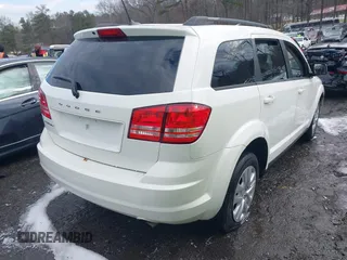 2018 Dodge Journey SE with VIN 3C4PDCAB1JT295988, listed as a IAAI auction lot 41226385 with 106,639 mi miles. Bid and sale history available at carsss.com. Image 4.